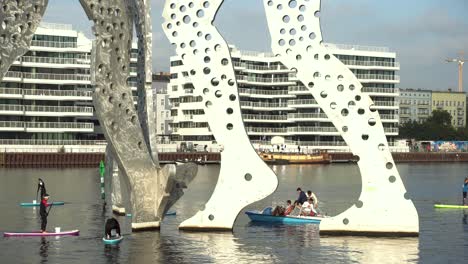 Stand-Up-Paddiing-in-Berlin-next-to-famous-Molecule-Man-on-river-Spree