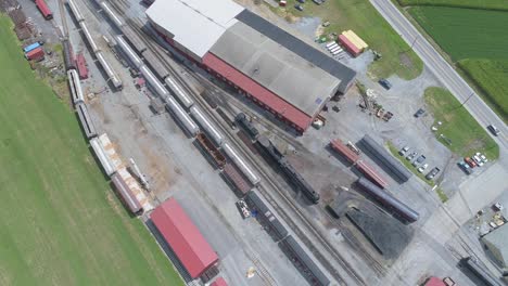 Aerial-View-of-a-Train-Yard-with-a-Steam-Engine-N-W-611-Warming-Up-on-a-Sunny-Summer-Day