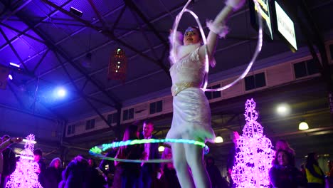 Hula-Hooper-in-Victoria-Night-Market,-during-winter-season,-July,-2019-Queen-Victoria-market-nighttime-during-winter