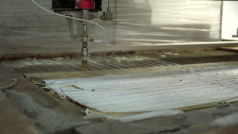 Cleaning-the-foam-on-the-CNC-water-jet-cutter-with-water-pistol