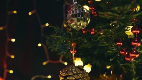 track-past-decorations-and-lights-hanging-on-Christmas-tree