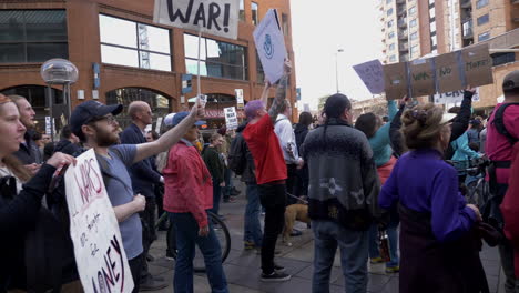 Protesters-hold-up-signs-at-an-anti-war-rally-in-downtown-Denver-Colorado