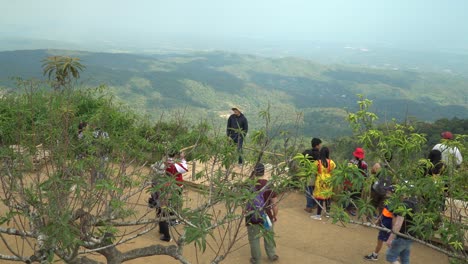 Amazing-Scenic-overlook-with-tourists-on-a-platform-and-the-beautiful-mountains-of-Chiang-Mai,-Thailand-in-the-background