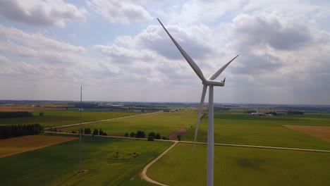 Static-aerial-shot-of-a-rotating-wind-turbine