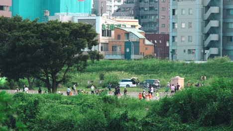Tamagawa,-Japan-With-People-Playing-And-Relaxing-On-A-Breezy-Day---tripod-shot