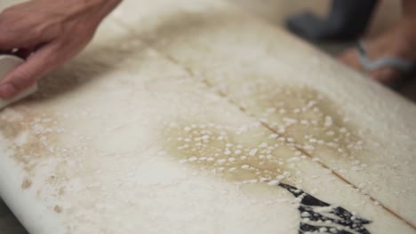 Slow-Motion-120fps---Guy-is-waxing-his-surfboard-using-sex-wax