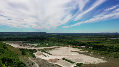 Aerial-landscape-showing-a-chalk-quarry,-on-bright-sunny-day