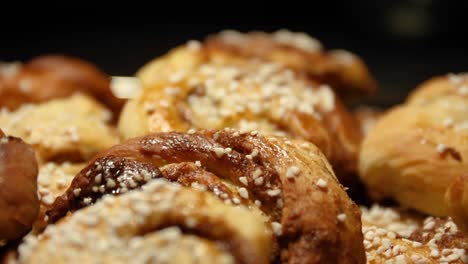 Pushing-in-on-many-cinnamon-buns