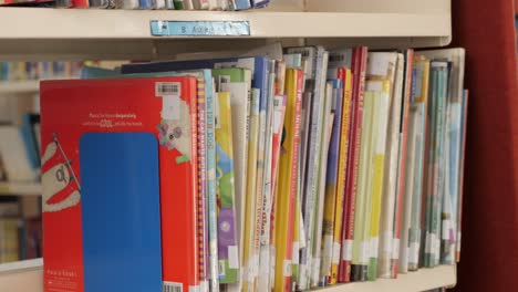 CLOSE-UP,-Colorful-School-Library-Books-Stacked-Together-On-A-Shelf