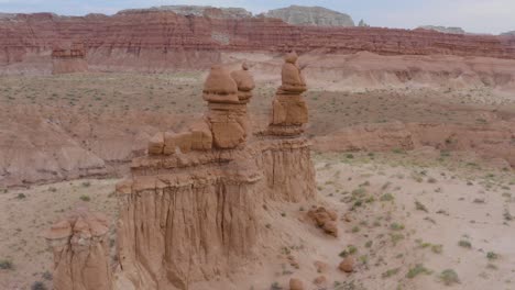 Aerial-Drone-Flight-Around-Stone-Hoodoos-Guarding-the-Valley-of-the-Goblins-State-Park-in-Utah,-USA