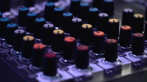 Extreme-close-up-view-of-the-mixing-knobs-of-different-color