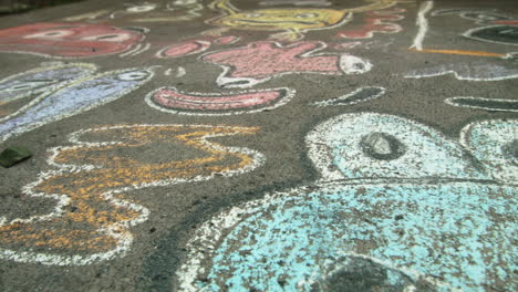 Sidewalk-chalk-art,-Close-Up,-Slide-Left