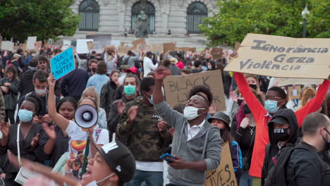 Porto-Portugal---june-6th-2020:-BLM-Black-Lives-Matter-Protests-Demonstration-crowd-protesting-with-masks-and-speaker-with-megaphone