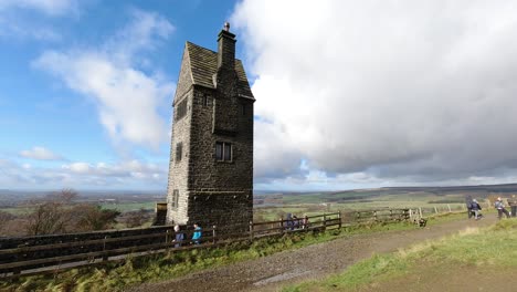 Timelapse-hikers-Rivington-historic-spooky-pigeon-tower-English-rural-countryside-tourist-landmark