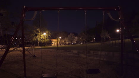Empty-swings,climbing-bars,playground-at-night,Prague,Czechia,during-lockdown