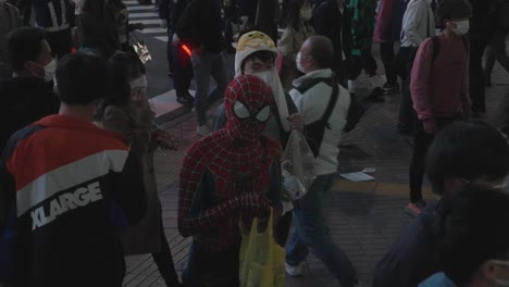 Person-In-Spiderman-Costume-Walking-At-Shibuya-Crossing-On-A-Halloween-Night-In-Tokyo---slow-motion