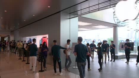 Customers-queue-in-line-as-the-Apple-store-opens-to-the-public-during-the-launch-day-of-the-new-iPhone-12-and-iPhone-12-Pro-phones