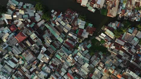 top-down-drone-view-over-rooftops-of-an-old-and-high-density-residential-area-of-Binh-Thanh-District-of-Saigon-AKA-Ho-Chi-Minh-City,-Vietnam