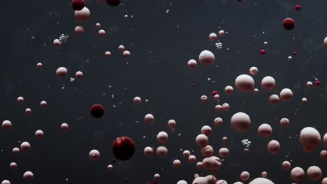 Abstract-pattern-of-nail-polish-bubbles-in-water,-circular-movement