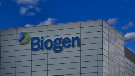 Static-wide-shot-of-Biogen-neuroscience-company-in-Switzerland-with-moving-clouds-in-background,time-lapse
