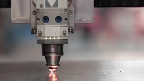 Automated-Laser-Cutter-Cutting-Metal-Sheet-With-Sparks-In-A-Factory