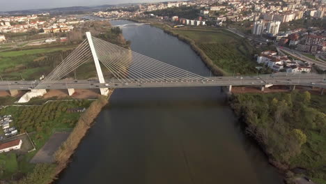 View-Of-Rainha-Santa-Isabel-Bridge-In-Coimbra-With-Different-Buildings-and-Trees---Drone-Shot