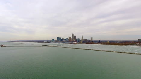 Wide-revealing-drone-shot-of-downtown-Cleveland-Ohio-and-Lake-Erie