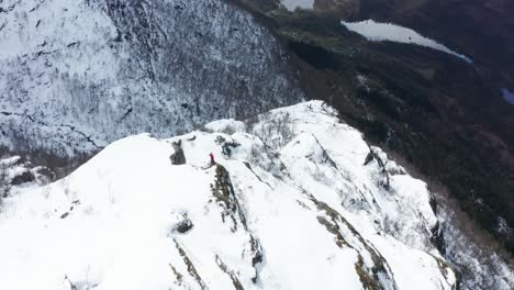 Aerial-shot-towards-single-person-on-top-of-Icy-Norwegian-Mountain