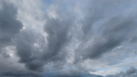 Changeable-weather-with-clouds-passing-by,-long-shot-time-lapse