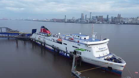 Stena-Line-freight-ship-vessel-loading-cargo-shipment-from-Wirral-terminal-Liverpool-aerial-descending-view