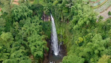Aerial-view-of-tropical-Curug-Silawe-waterfall-in-Magelang,-Java,-Indonesia
