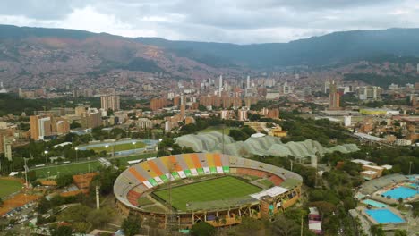 Birds-Eye-View-of-Atanasio-Girardot-Stadium-with-Medellin-Skyline-in-Background