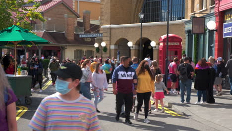 Many-people-walking-through-Universal-Orlando-wearing-masks-during-Coronavirus-Pandemic