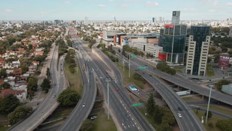 Aerial-establishing-shot-over-General-Paz-avenue-with-Buenos-Aires-city-behind