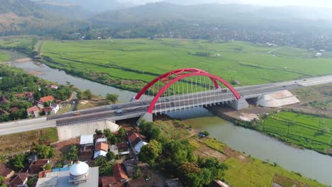 Red-Kali-Kuto-bridge-on-Trans-Java-toll-road,-Indonesia,-aerial-orbital-view