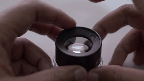 Fingers-Tapping-On-Loupe-Magnifier