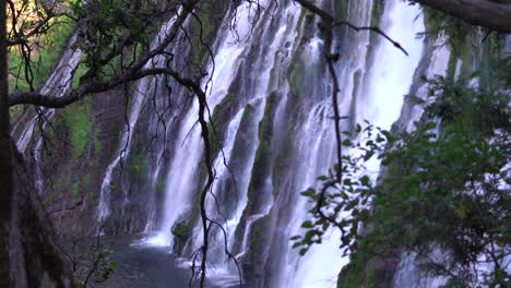 A-side-view-of-Burney-Falls-cascading-down-volcanic-rocks-at-Burney-Falls-State-Park-in-Shasta-County