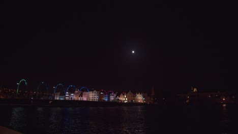 Willemstad-the-capital-city-of-Curacao-with-the-Queeen-Emma-Bridge-in-the-foreground-and-the-moon-rising-over-the-city