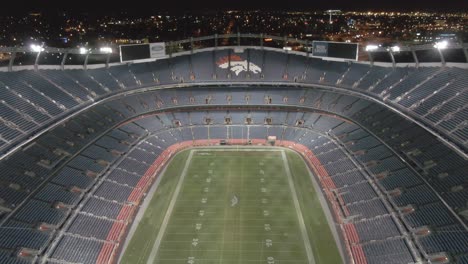Aerial-shot-of-the-Denver-Empower-Field-at-Mile-High-stadium-lit-up-at-night-after-the-game-against-the-Pittsburgh-Steelers
