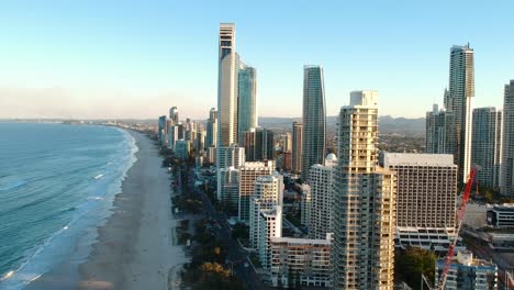 Aerial-view-of-high-rise-building-built-next-to-a-popular-tourist-beach