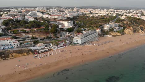 Aerial,-Skyline-of-a-touristic-city-in-Algarve,-South-Portugal