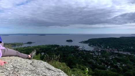 4K-Lady-Looks-at-Camden-Maine-from-Atop-Mount-Battie