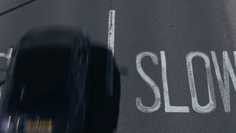 Painted-on-the-tarmac-are-the-instruction-to-drivers-to-be-slow