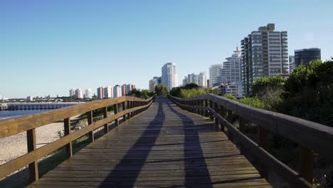 Punta-del-Este-boardwalk-travelling-towards-city-first-person