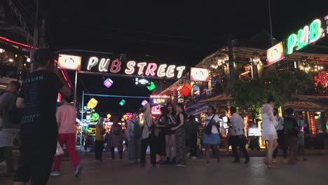 Crossroads-at-the-Center-of-Pub-Street-Full-of-Tourists-at-Night