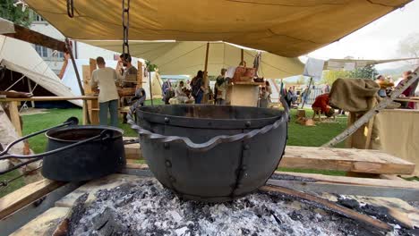 Food-cooking-in-old-middle-aged-pot,medieval-event,steady-slow-motion