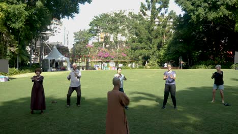people-Training-In-The-Park-with-monk