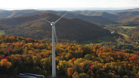 Electric-Windmill-turbine-wind-farm-aerial-clean-energy-colorful-hills-in-autumn