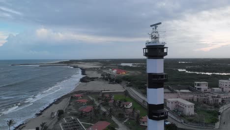 4k-aerial-view-of-a-Lighthouse-near-the-port-harbor-shot-with-a-drone-in-Pondicherry,-India