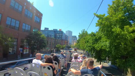 Seattle-streets-from-tourist-bus-without-roof,-sunny-vacation-day-in-Summer
